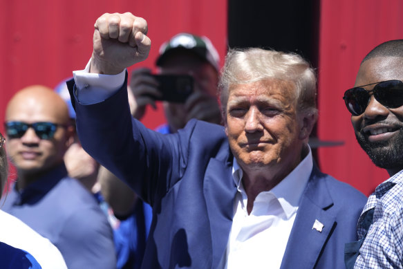 Donald Trump greets supporters at the Iowa Pork Producers tent at the Iowa State Fair on Saturday.