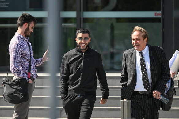 Adrian Portelli (centre) leaves Sunshine Magistrates’ Court last month after facing driving charges.