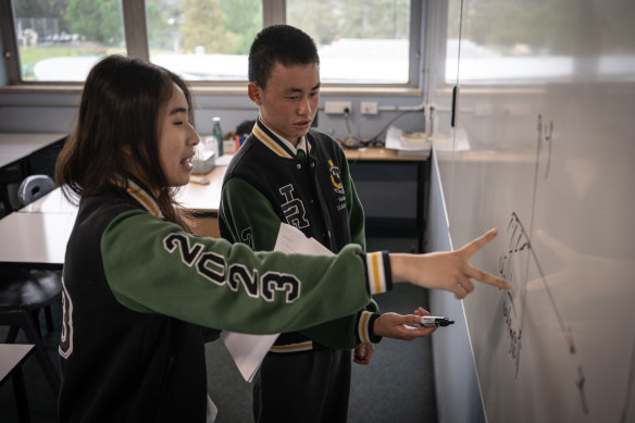 Sizhe Pan and Vivian Xu from James Ruse Agricultural High School attempt the final question from the maths extension 2 paper.