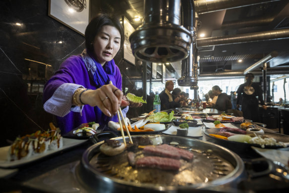 Jumee Lee cooks Korean BBQ for lunch at BBQ King on King Street. 