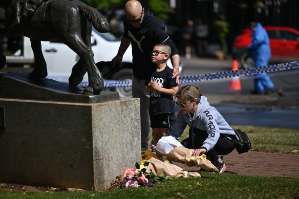 Floral tributes are laid at the crash scene on Monday.