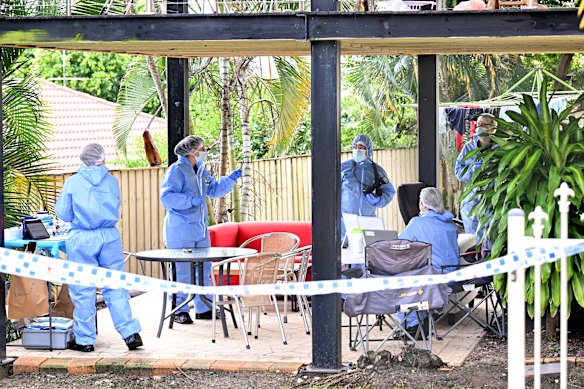 Forensic police at a home in Springfield Lakes, west of Brisbane, on Saturday.