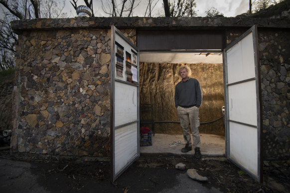 Berambing resident Lionel Buckett with his fire bunker for 20 people that was nearly finished when the bushfires hit his region of the Blue Mountains this past summer.