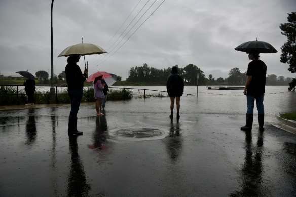 Residents gather to shoot the breeze as the river rises.