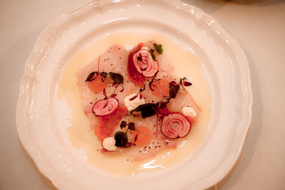 Kingfish Carpaccio with cream, blood orange, citrus oil and radish.