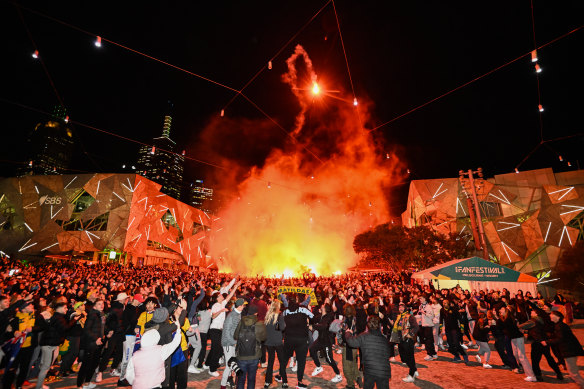 Crowds at Federation Square watch the Matildas play England on August 16.