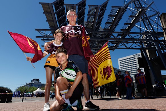 Adrian Harch with his children, Ella and Lachlan, outside Accor Stadium.