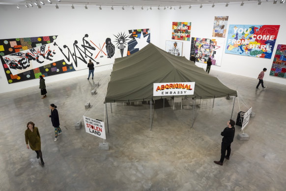 Inspired by the Aboriginal Tent Embassy in front of the old Parliament House in Canberra, Embassy is  a large marquee in which visitors sit and watch videos or listen to talks.