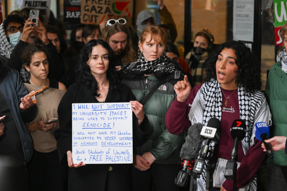 Zara Chauvin-Cunningham and Dana Alshaer speak to the media during the protest.