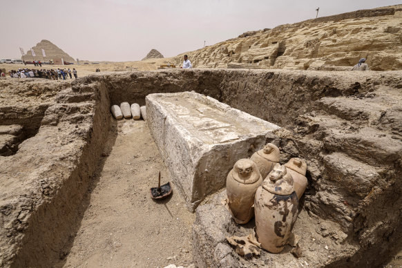 Visitors tour the site in the Saqqara necropolis south of Cairo, where archaeologists unearthed two human and animal embalming workshops, where embalming beds and canopic jars were found.
