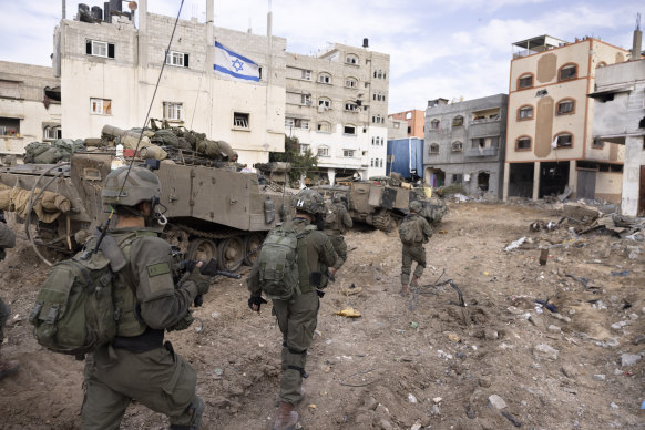 Israeli soldiers take part in a ground operation in Gaza City’s Shijaiyah neighbourhood.