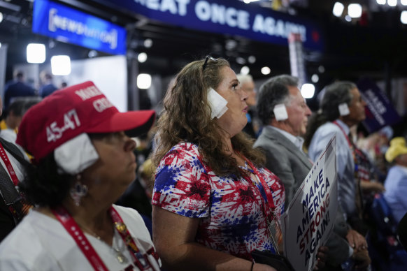 Delegates wear a bandage on their right ear during the Republican National Convention.