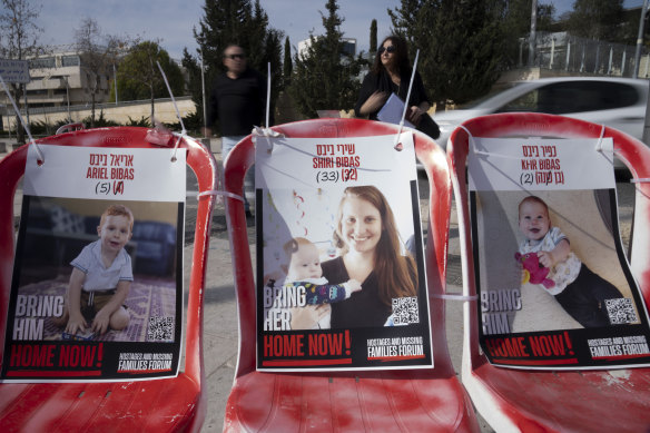 Posters of Shiri Bibas and her sons Ariel and Kfir, who were taken hostage by Hamas on October 7, 2023 and whose bodies were returned on Feburary 20.