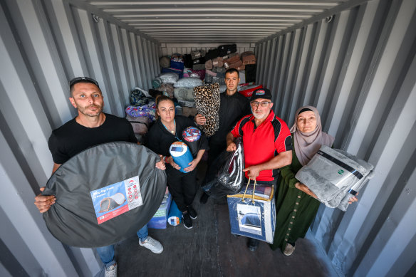 Volunteers (from left to right) Konur Alp Ozal, Bea Tercan, Fatih Ustun, Necmi Kul and Necmiye Kul at the collection centre in Campbellfield where donations are being stored for  earthquake victims in Turkey. 