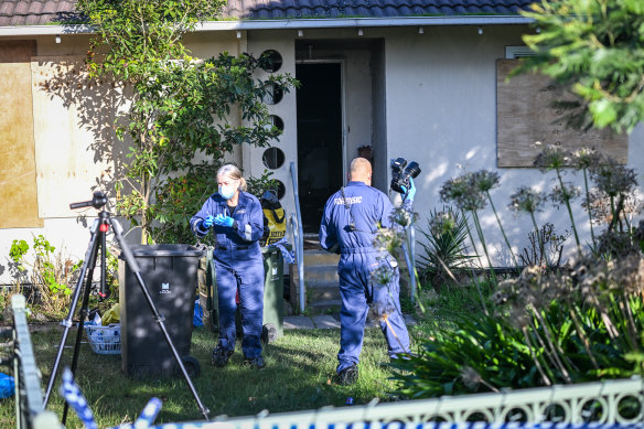 Forensic officers on Saturday at the scene of a fire and alleged fatal assault in Binalong Avenue, Chadstone.