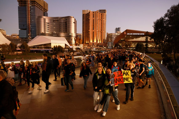 Fans arrive at Adelaide Oval for the opening match of Gather Round between the Crows and the Blues.