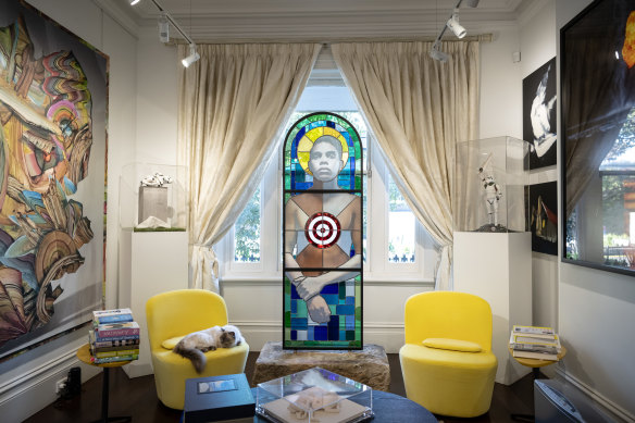 Rob and Patricia Postema’s living room with Tony Albert’s stained glass work <i>Brothers (The Prodigal Son).
