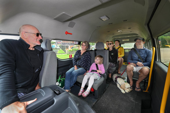 Volunteer Frank Schrever with a bus full of passengers at Sandy Point. 