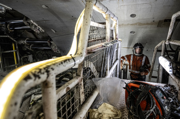 A worker inside a tunnel boring machine about to weave its way under Parramatta for the Metro West line.