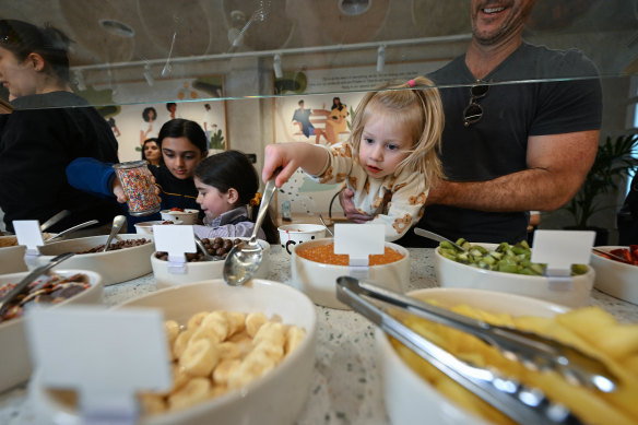 Mila Morgan, age four, picks her own Yo-Chi (vanilla, chocolate, chocolate sauce, some banana, Nutella and raspberry) in Melbourne’s Malvern store on Thursday.