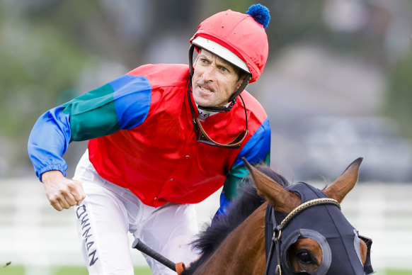 Hugh Bowman celebrates after winning the Spring Champion Stakes on Sharp ‘N’ Smart.