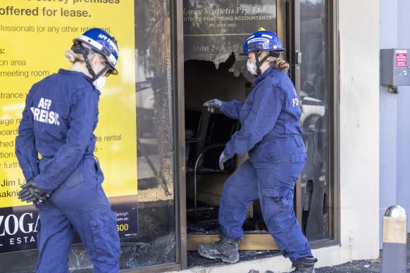 Specialists from the arson squad investigating the blaze on Wednesday.