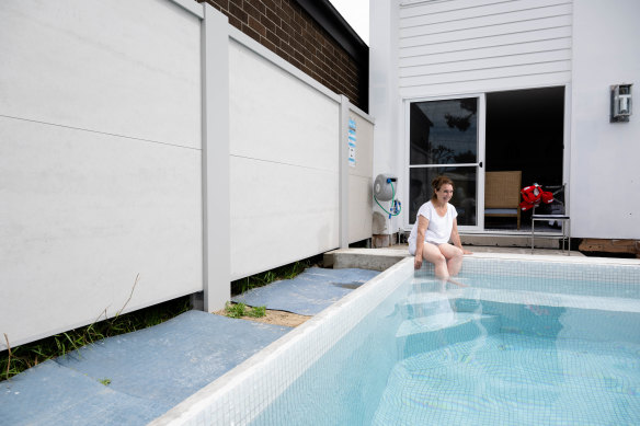 Christine Perry enjoys her newly installed swimming pool.