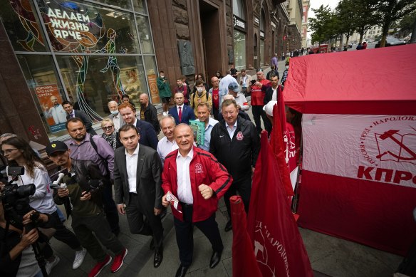 Russian Communist Party leader Gennady Zyuganov, centre in red, on a campaign march with other party activists in Moscow in August.