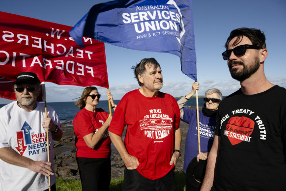 Unionists (from left) Shane Elliott, Elizabeth Scott, Maurie Mulheron, Sharon Callaghan and Pat Bates are protesting about the proposed nuclear submarine base in Port Kembla, NSW.