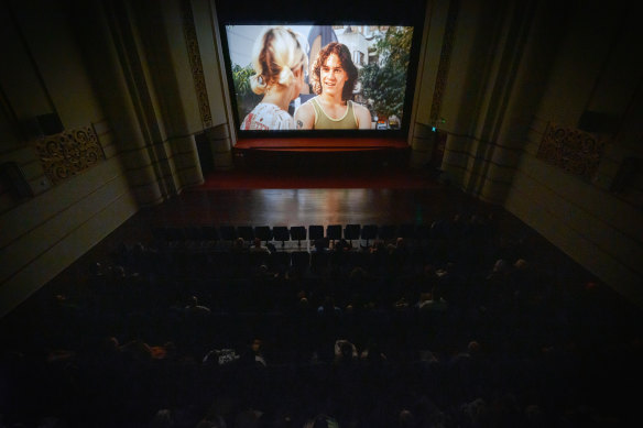 An audience watches the Aussie classic Two Hands on film. 