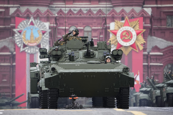 Russian military vehicles roll across the red Square ahead of Vladimir Putin’s speech. 