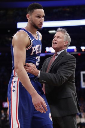 76ers head coach Brett Brown, right, talks to Ben Simmons (25) during the second half of an NBA basketball game against the New York Knicks.