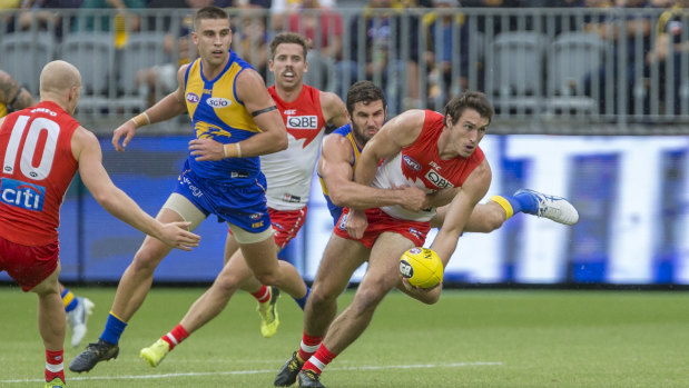 Flying tackle: West Coast's Jack Darling gets to grips with Sydney's Dean Towers.
