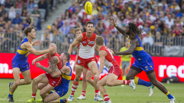 Welcome return: West Coast's Nic Naitanui (far right) takes possession ahead of Sydney's Kieren Jack.