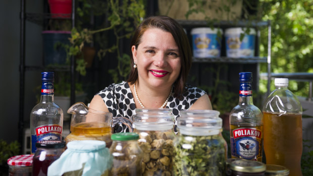 Serina Bird with an assortment of her own handmade kombucha, alcohol, jams and sauces as well as hand-picked tea leaves and mushrooms. 