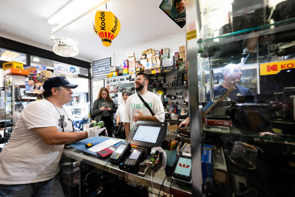 Nick Vlahadamis at his Sydney Super8 store in Newtown where the sale and processing of film is booming. A recent revival in film photography follows years of declining employment in the film processing industry.
