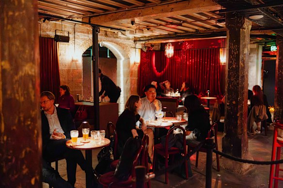 Razz Room's beautifully lit space of exposed beams, blood-red velvet curtains and intimate little tables.