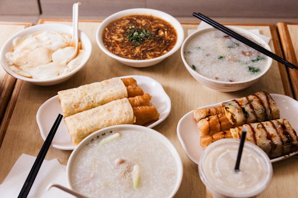 Clockwise from top right: Vegetarian combination congee; shallot pancake and youtiao with sweet soy sauce; chicken fillet congee; egg pancake and youtiao; soy pudding in brown sugar; Taiwanese hot and sour soup.
