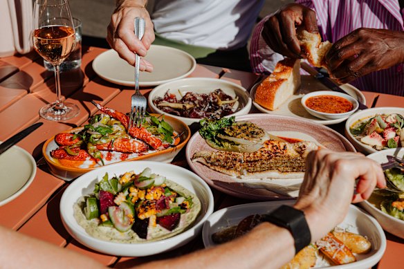 Clockwise from left: Barbecue corn with plum and macadamia green goddess; heirloom carrots; wild kangaroo salami; focaccia with harissa butter; and grilled Murray cod.