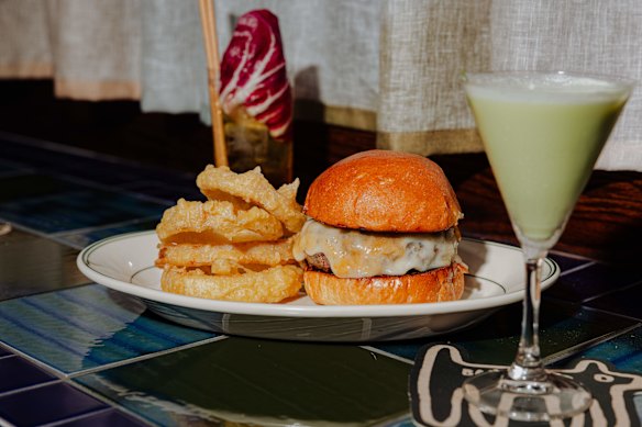 The Bar Bruno burger with provolone cheese, pickles and onion rings.