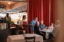 Hannah Green (in blue) on the floor at her sophomore restaurant, Daphne.