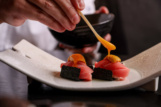 Prop up at the sushi counter for an omakase-style experience.