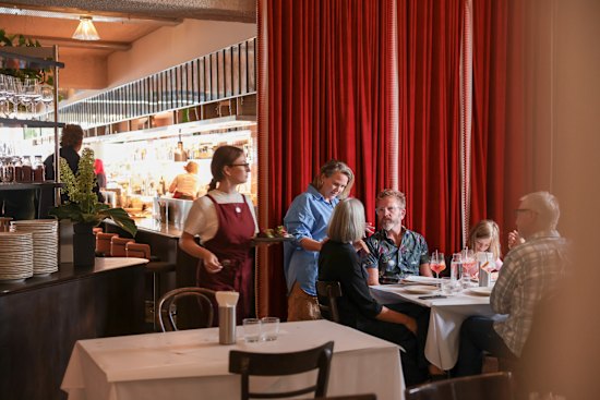 Hannah Green (in blue) on the floor at her sophomore restaurant, Daphne.