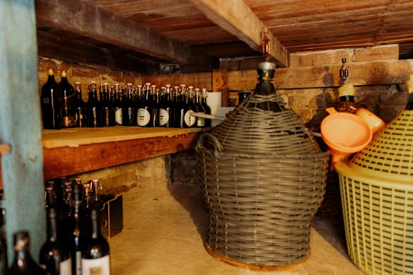 Homemade wine and vinegar ageing in the cellar.