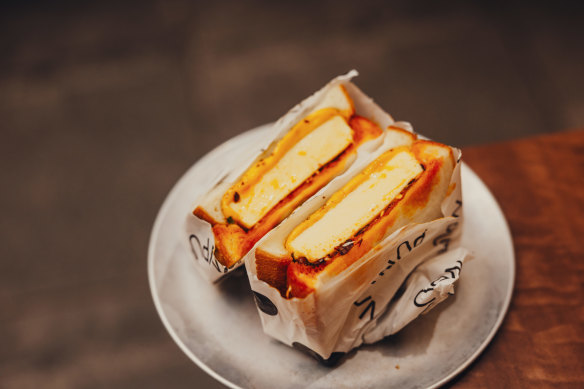 Steamed custard egg sandwich with chilli oil.