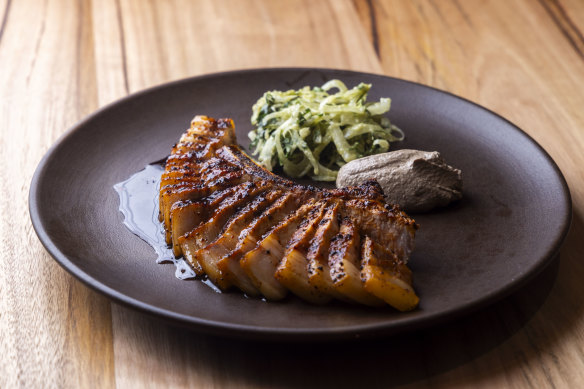 Chilli-rubbed, grilled pork chop with creamy walnut sauce.