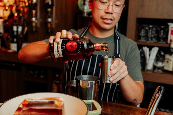 Michael Chiem adds rum, which gives the punch a Christmassy kick.