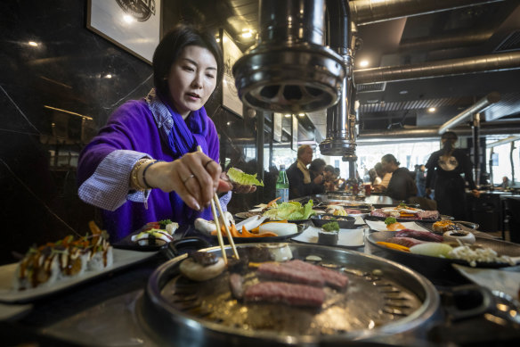 Jumee Lee cooks Korean BBQ for lunch at BBQ King on King Street.