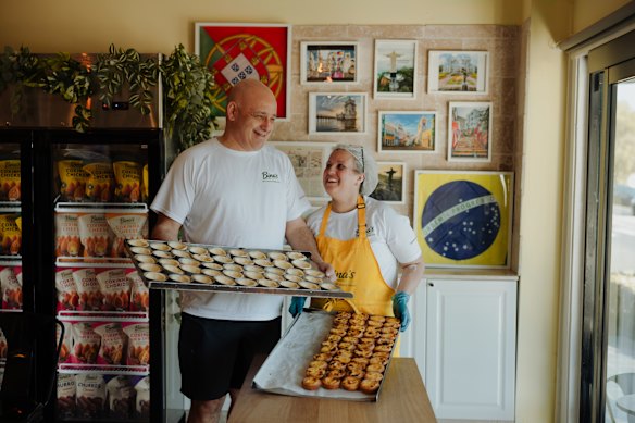 Baked@Bina’s owners Sabrina and Brian Dias with their handmade Portuguese tarts, at their Brazilian Portuguese bakery in Earlwood.