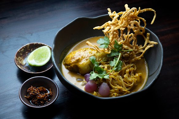 Chicken khao soi with pickled whole shallots.